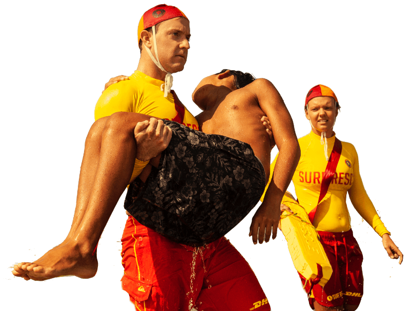 Lifesavers rescuing a boy from the surf